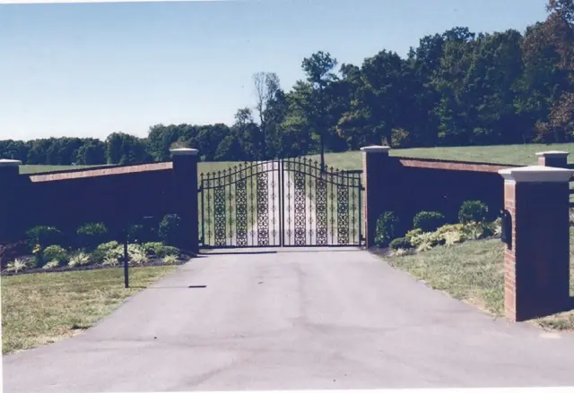 Ornamental farm entrance gate with brick wall - Elantra Gate Systems