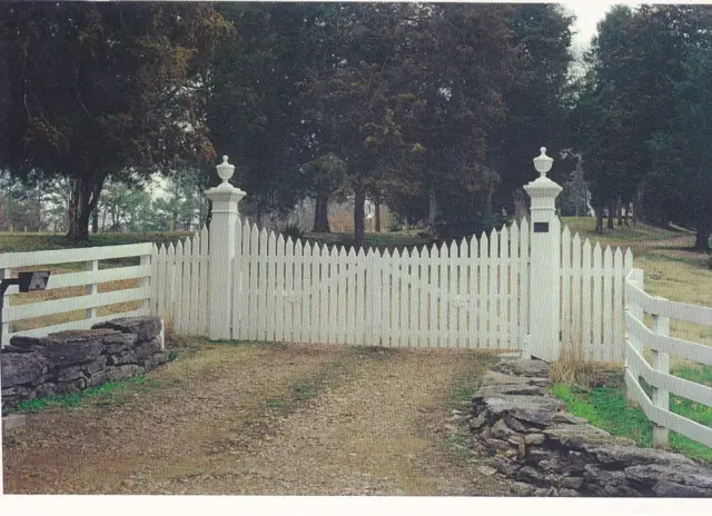 White farm entrance swing gate with stone walls - Elantra Gate Systems